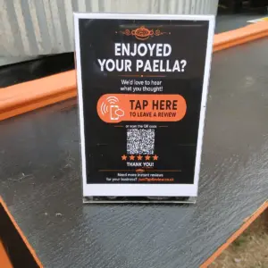 Personalised Google review stand with NFC tap and QR code for Your Paella